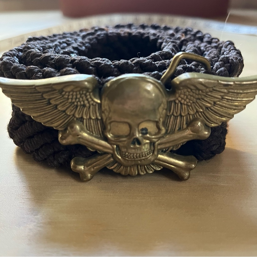 Vintage Baron solid brass flying skull and crossbones buckle on brown woven belt